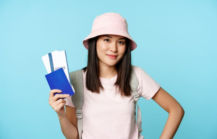 smiling-korean-girl-tourist-showing-passport-tickets-flight-booking-hotel-going-trip-voya-min